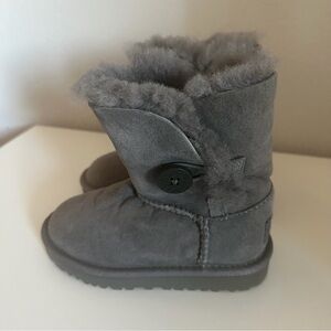 UGG Bailey Button II boots in grey suede with a single wood-button closure.